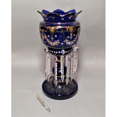 1169 - Late 19th century blue glass lustre with gilt and enamelled overlay, 37cm high (some drops vacant)