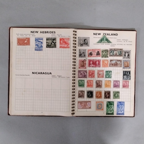 Three stamp albums containing a quantity of British and worldwide