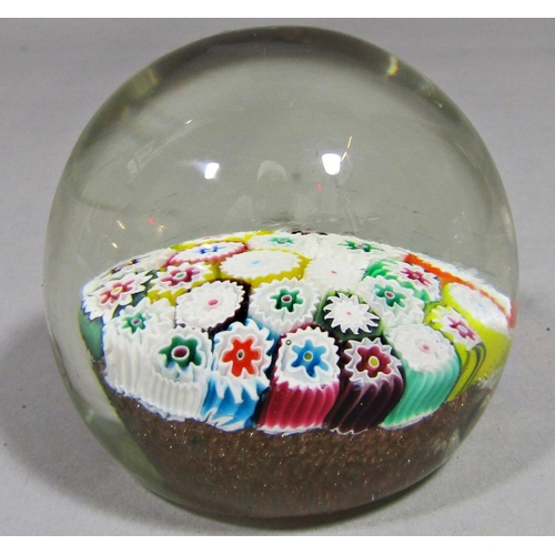 1162 - Four various glass paperweights to include a large dump paperweight with bubbled and swirled interio... 