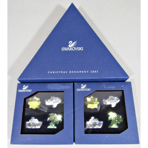 1165 - Swarovski Christmas ornament 2003 in original box, together with two boxes of For Swarovski Crystal ... 