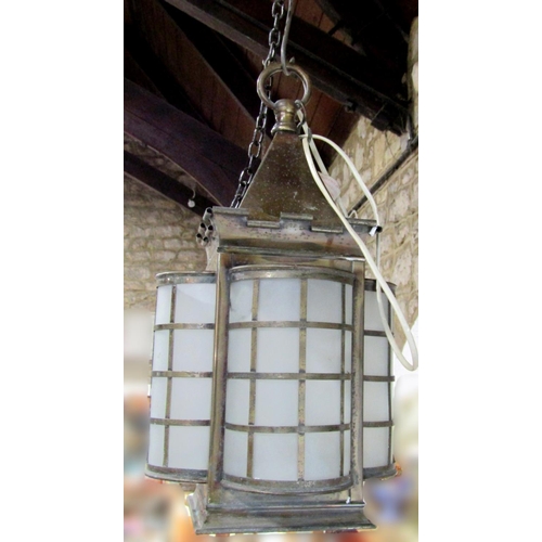 570 - Good quality arts and crafts brass hall lantern with four domed sides and turreted top, 30cm high