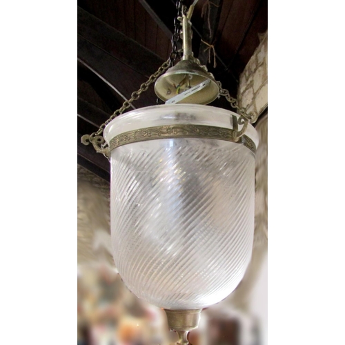 571 - A pair of wrythen fluted domed glass and brass hanging hall lanterns, 36cm high