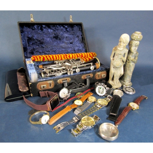 576 - Cased ebonised clarinet together with two tribal figures, and a collection of gent's fashion wrist w... 