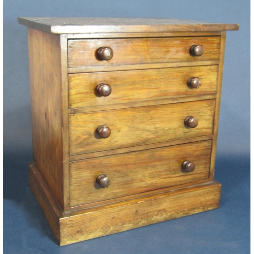 578 - Mahogany apprentice or table top chest of drawers fitted with four long graduated drawers, 32cm high