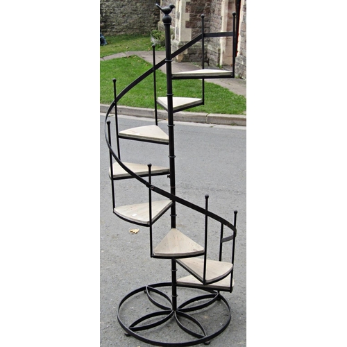 2073 - A novelty conservatory or garden planter in the form of a spiral staircase with iron frame and woode... 