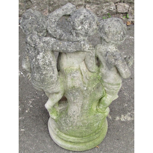 2088 - A reclaimed garden ornament/water feature in the form of three frolicking cherubs beside a tree stum... 