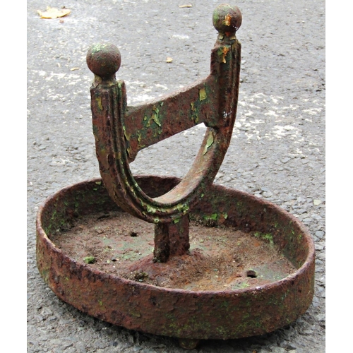 2102 - A weathered 19th century cast iron boot scraper, stamped Carron, raised on an oval tray base, 26cm h... 