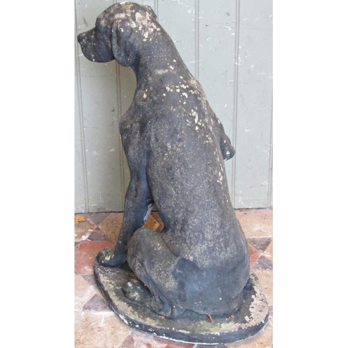 2114 - A reclaimed garden ornament in the form of a seated hound with well defined features, 70 cm high