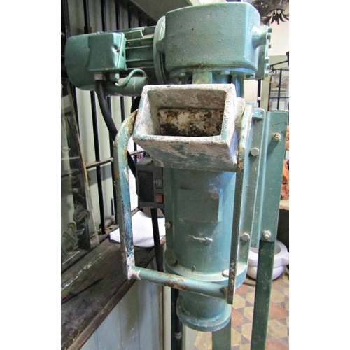 2122 - A cast iron floorstanding potters electric pug mill