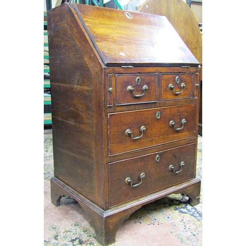 2732 - A small Georgian country made bureau of two long and two short drawers, the fall flap enclosing the ... 