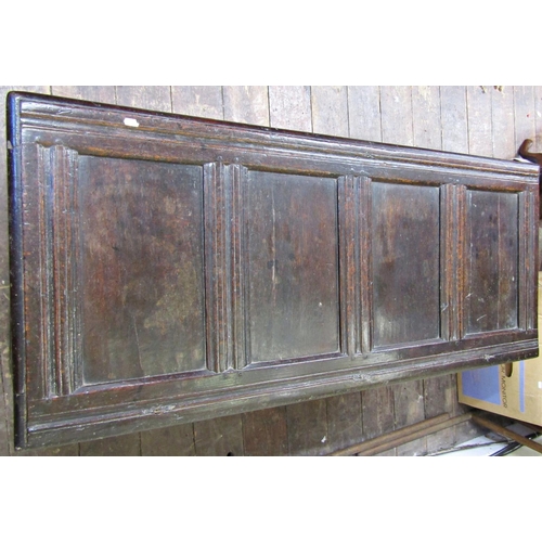 2756 - An 18th century oak coffer with panelled framework, the front elevation with carved floral detail se... 