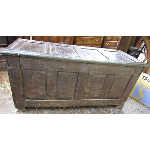 2756 - An 18th century oak coffer with panelled framework, the front elevation with carved floral detail se... 