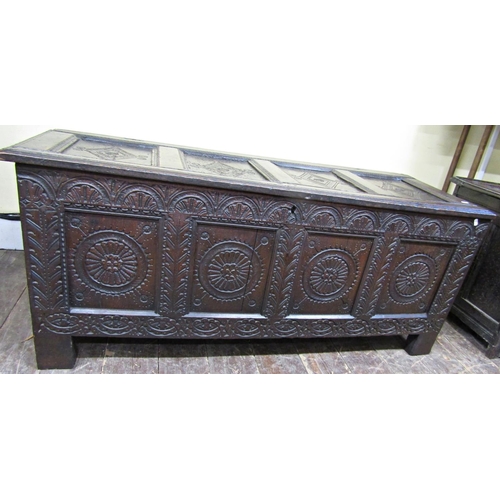 2761 - An 18th century oak coffer panelled frame, profusely carved and repeating geometric detail, 145 cm w... 