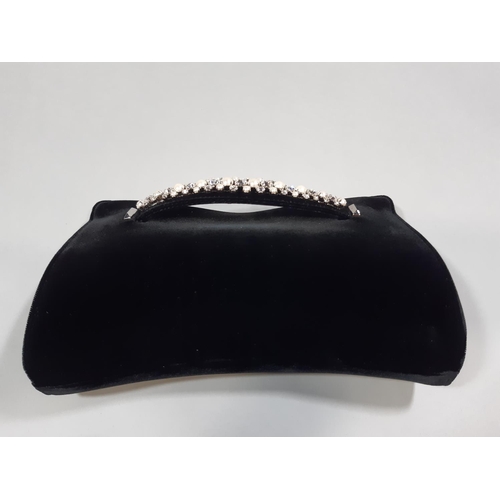 1560 - Jimmy Choo 'Venus' clutch bag in black velvet with crystal embellished bracelet strap at front, inte... 