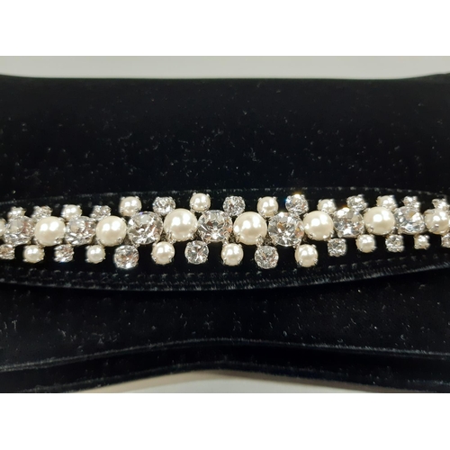 1560 - Jimmy Choo 'Venus' clutch bag in black velvet with crystal embellished bracelet strap at front, inte... 