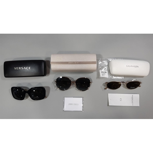 1563 - 3 pairs of designer sunglasses by Versace, Jimmy Choo and Calvin Klein, all cased and unused