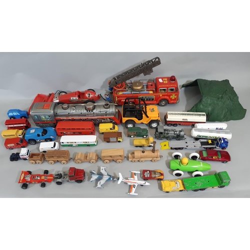 68 - Mixed collection of unboxed vintage model vehicles including large tinplate fire engine, battery ope... 