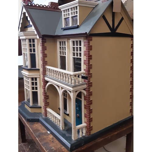 78 - Impressive vintage wooden dolls house in the style of a Victorian town house  with painted finish, a... 