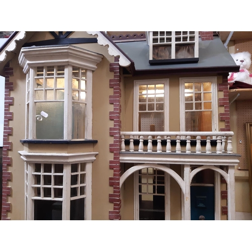 78 - Impressive vintage wooden dolls house in the style of a Victorian town house  with painted finish, a... 