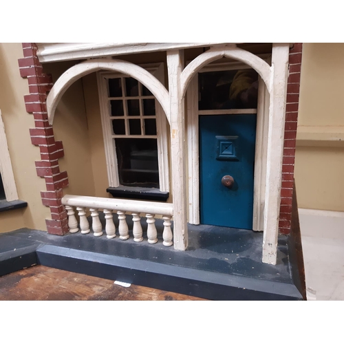 78 - Impressive vintage wooden dolls house in the style of a Victorian town house  with painted finish, a... 