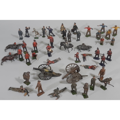 82 - A collection of lead figures, some with 'Britains' mark, including WW1 soldiers, Scottish Guards, Mo... 