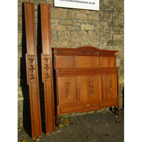 2138 - A oak double bedstead with panelled head and footboards, within a moulded and carved framework, rais... 