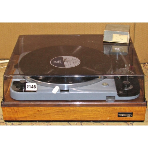 2146 - A Thorens record player model TD124/11 number 75564 together with an Ortofon boxed stylus 78 (2)