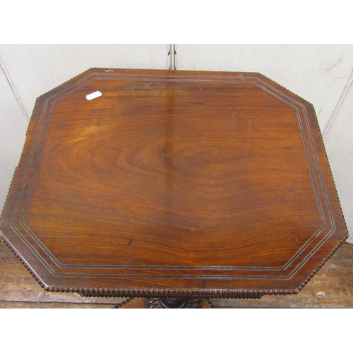 2725 - A Regency mahogany ladies sewing table of octagonal form the rising lid revealing fitted interior wi... 