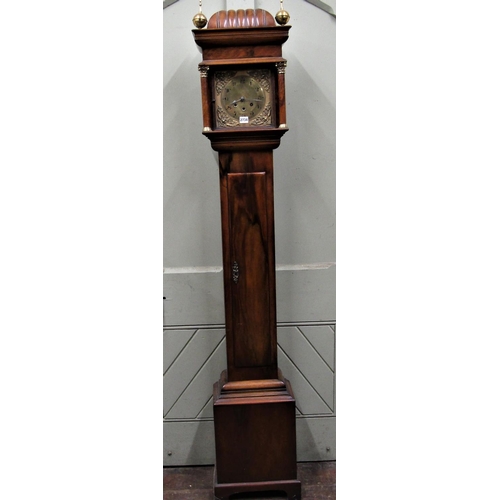 2734 - A walnut longcase clock, the hood enclosing a square brass dial with column supports and eight day t... 