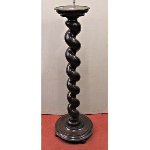 2735 - A jardiniere stand with spiral column on moulded circular base, 105 cm high