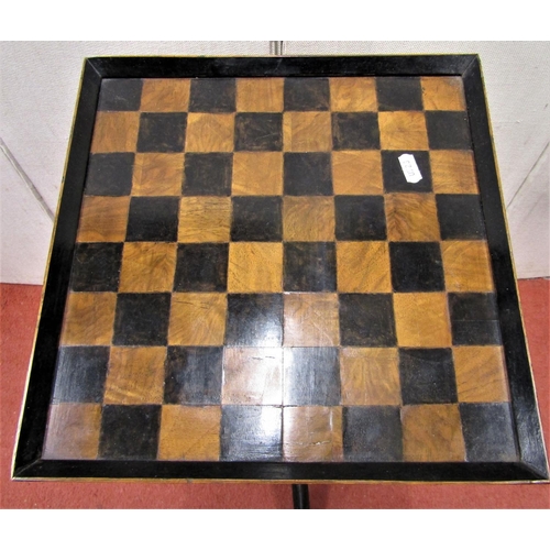 2736 - A small games table, the square cut top raised on a turned pillar and tripod base, 32 cm square