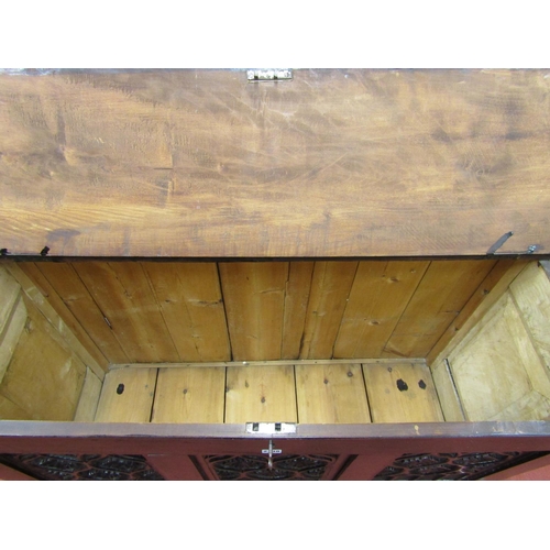 2738 - An antique coffer in the gothic style in mixed woods including sycamore, the rising lid over a panel... 