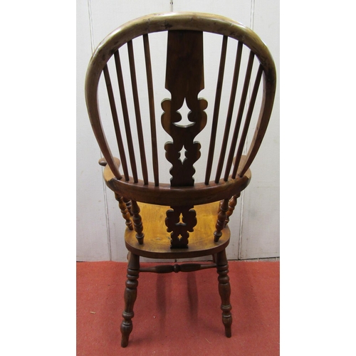 2754 - A good Georgian Windsor comb back elbow chair principally in elm and  yew wood with shaped and pierc... 