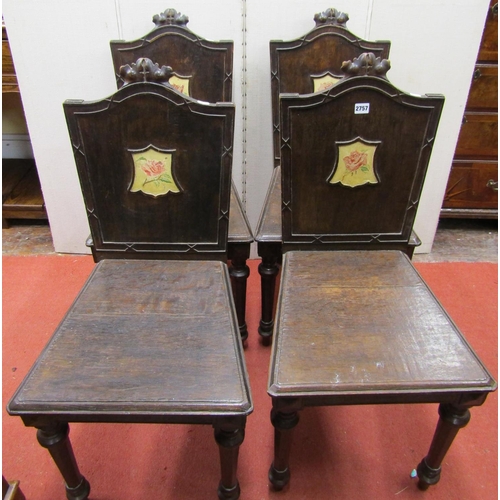 2757 - A set of four 19th century oak hall chairs, the backs with carved details and central cartouche with... 