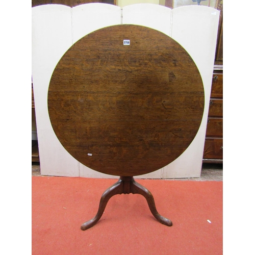 2758 - A Georgian oak snap top table, the circular top 90 cm in diameter, set on a turned pillar and tripod... 