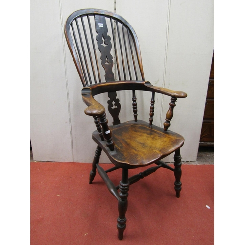 2759 - A Georgian Windsor comb back elbow chair principally in elm and fruitwood with carved and pierced sp... 