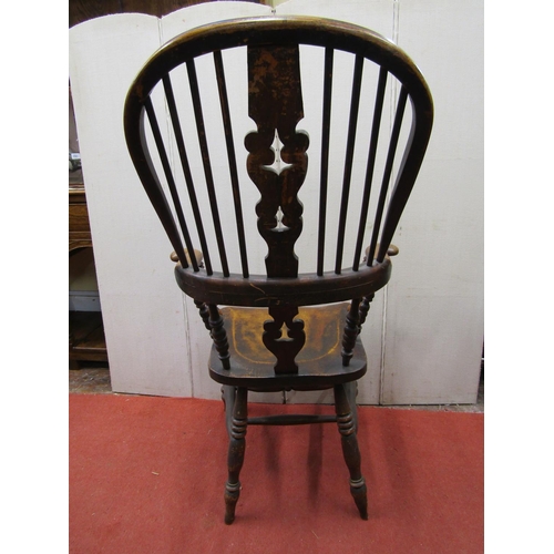 2759 - A Georgian Windsor comb back elbow chair principally in elm and fruitwood with carved and pierced sp... 