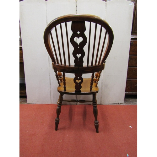 2760 - A Georgian comb back elbow chair principally in birch and yew wood with shaped and pierced splat and... 