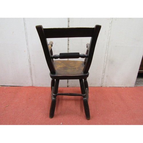 2771 - A Georgian Windsor child's chair with elm seat and further fruitwood and beechwood mouldings