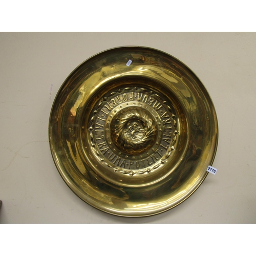 2775 - A 19th century brass arms dish with embossed detail with Latin script, to the centre rearing lion, 6... 