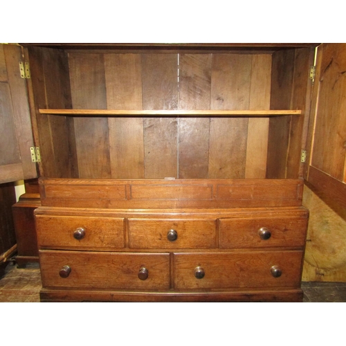 2783 - 18th century Welsh oak cupboard, the lower section enclosed by an arrangement of five drawers, the u... 