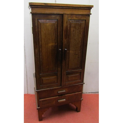 2785 - A small rosewood cabinet in an Art Deco design, the front elevation enclosed by a pair of panelled d... 