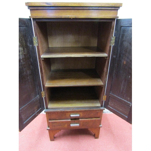 2785 - A small rosewood cabinet in an Art Deco design, the front elevation enclosed by a pair of panelled d... 