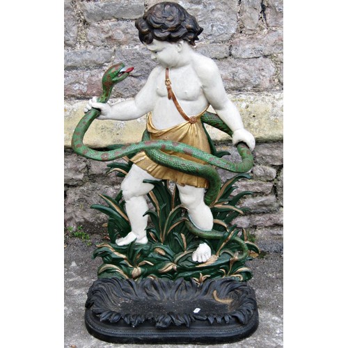 2113 - A vintage cast iron umbrella/stick stand in the form of young Hercules grasping a snake amongst foli... 