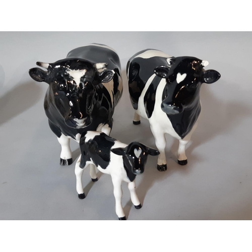 1093 - Collection of Beswick cattle comprising Guernsey  bull, 2 cows and calf, Freisian bull, cow and calf... 