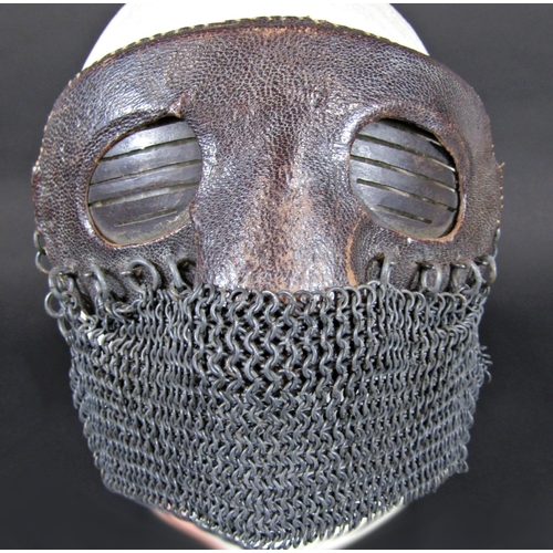 455 - A rare WWI tank crew splatter mask, the upper section of metal construction covered with leather, th... 