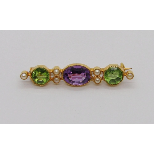 340 - Edwardian amethyst, peridot and seed pearl brooch in Suffragette colours, in unmarked yellow metal, ... 