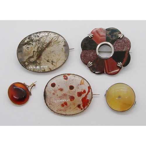 359 - Five antique brooches of various design all set with polished agate; two yellow metal and three whit... 