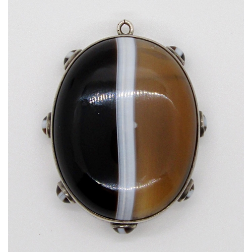 362 - Victorian Scottish banded agate mourning pendant, the large central cabochon agate within a surround... 