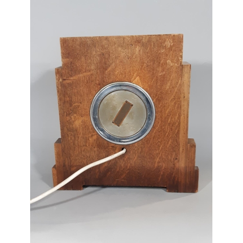 400 - A Ferranti mantel clock in an art deco style, the oak case enclosing an electric movement, with rect... 